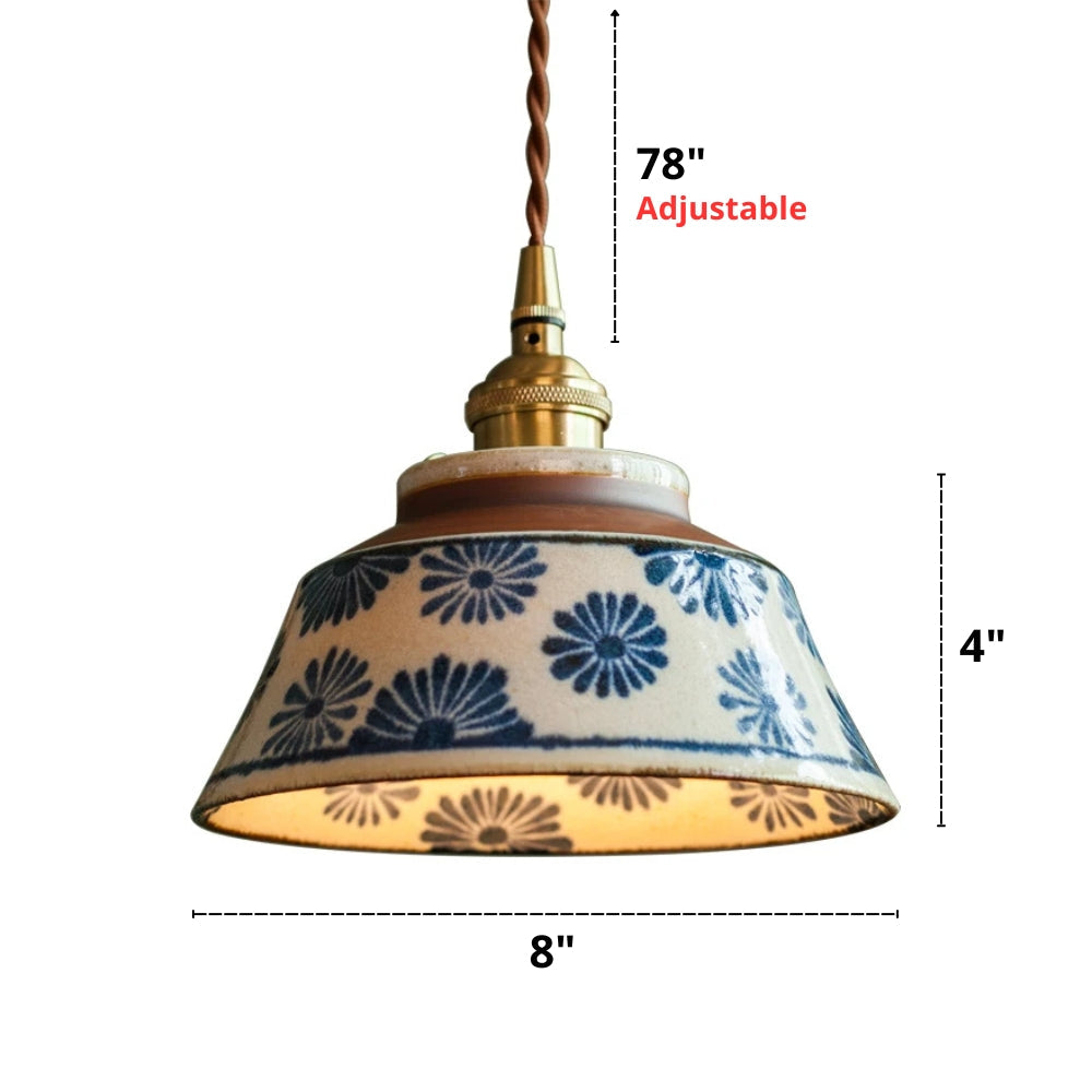 Pendant light with floral patterned shade and measurements on a white background