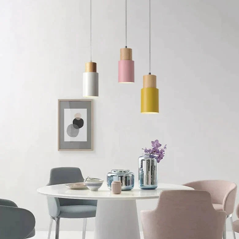 white, yellow, and pink wood base pendant lights