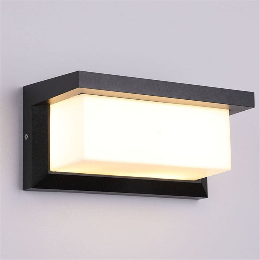 Modern outdoor wall sconce in sleek rectangular shape, glass and aluminum