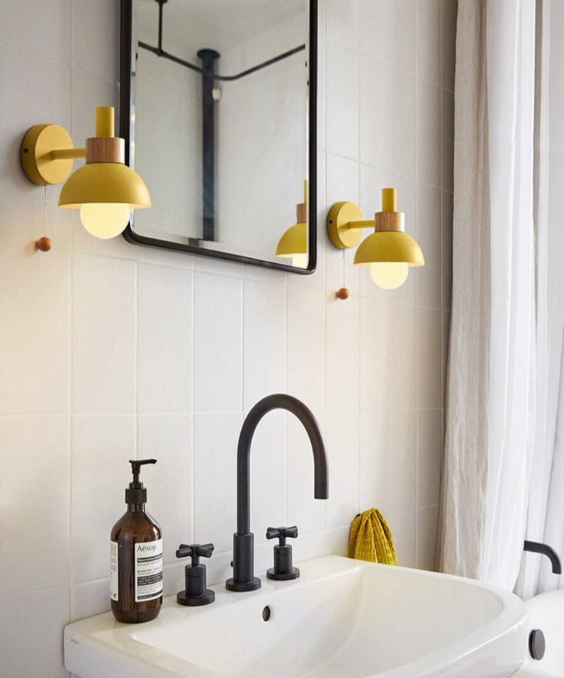 Yellow wall sconce for bathroom vanity