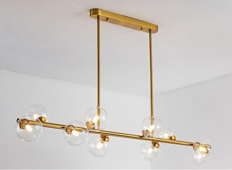 10 bulb clear glass horizontal chandelier in brass