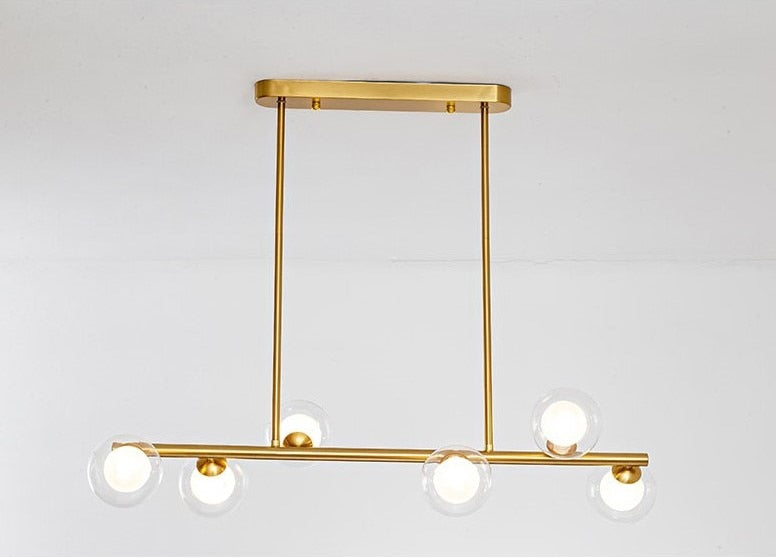 6 bulb clear glass globe horizontal modern chandelier with brass accents