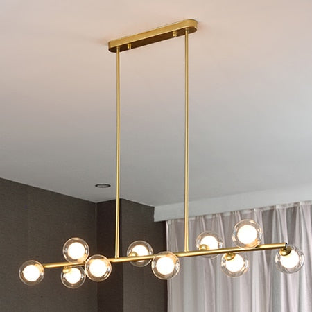 10 Bulb clear glass globe horizontal chandelier with brass accents