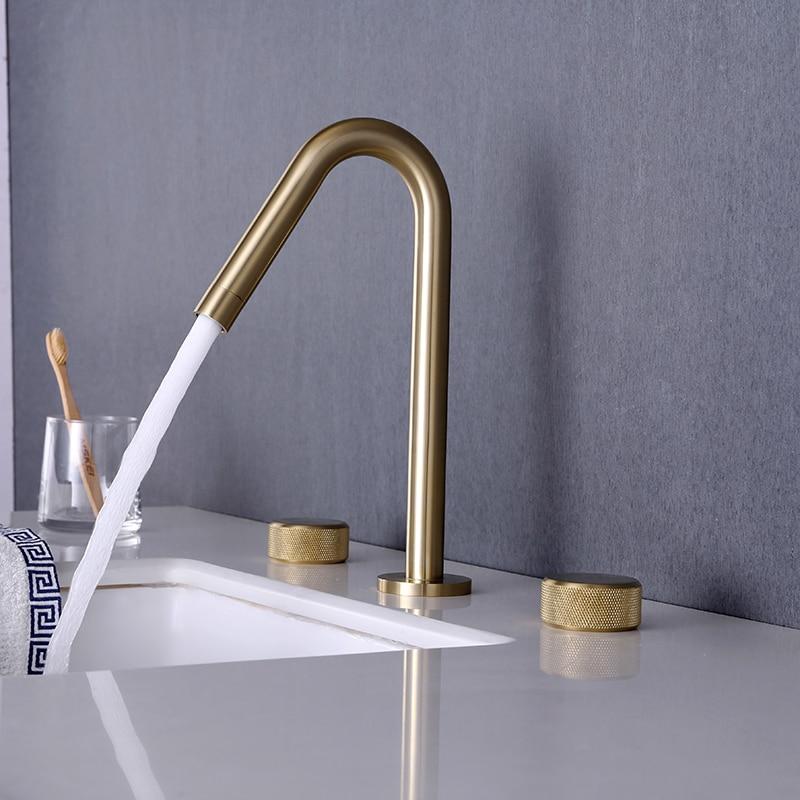 double handle bathroom faucet in gold