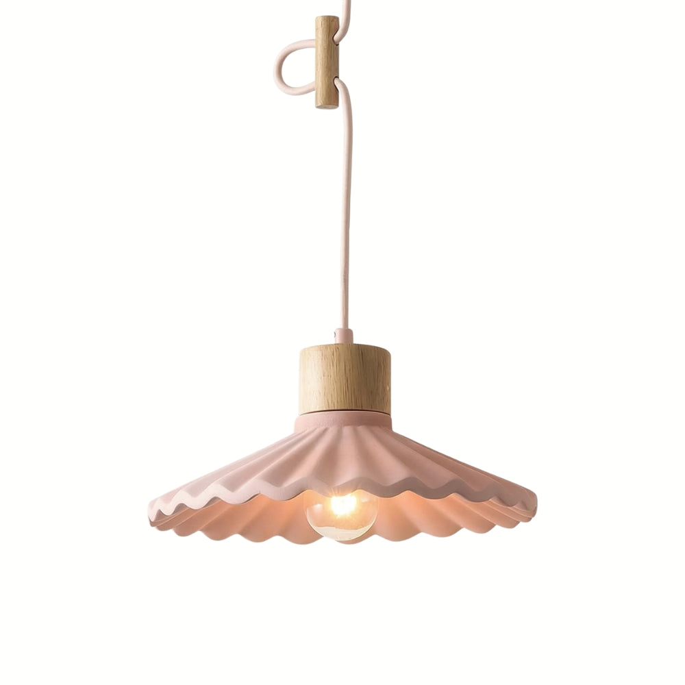 Pink pendant light with wooden base on a white background