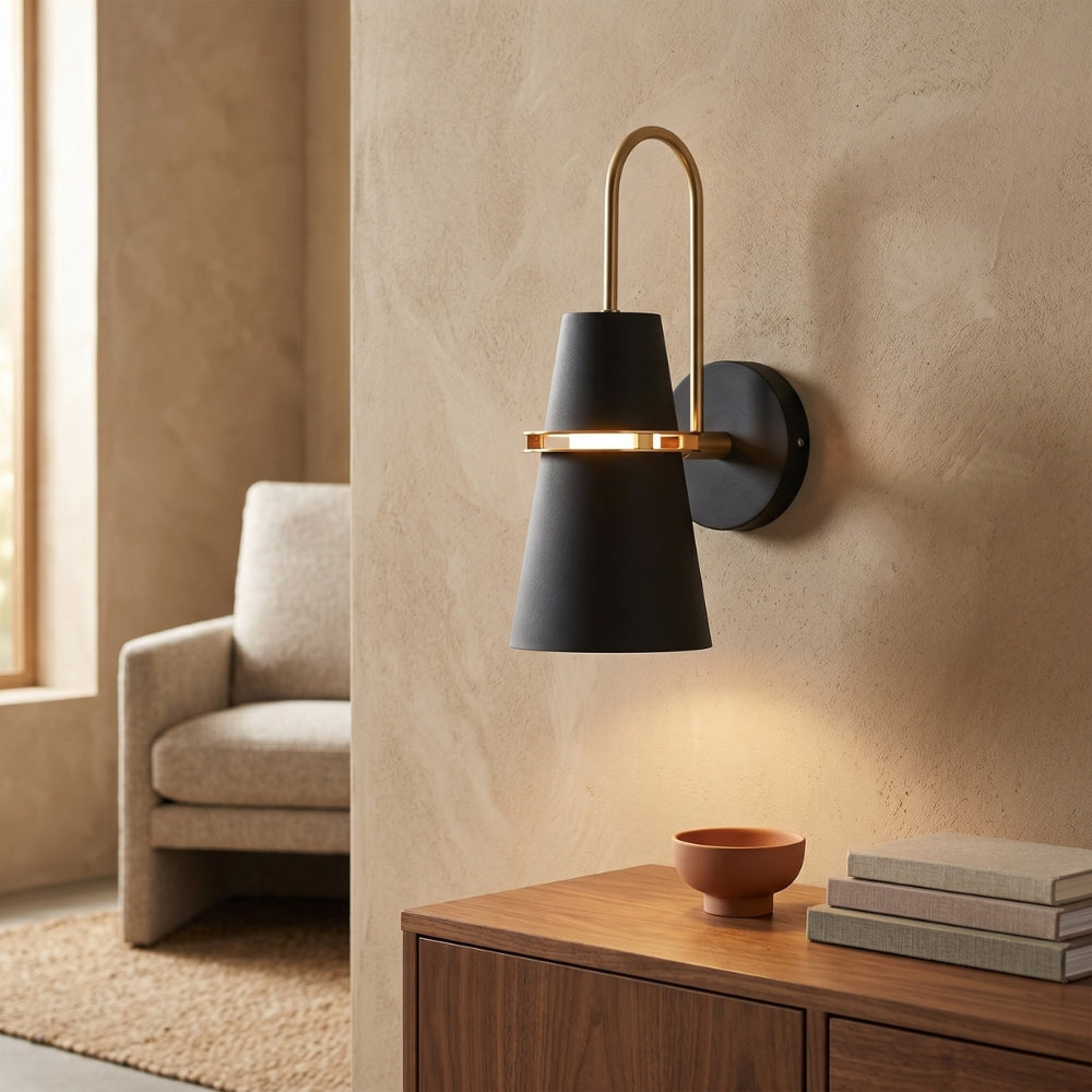 Modern wall sconce in a living room setting with a neutral color palette.