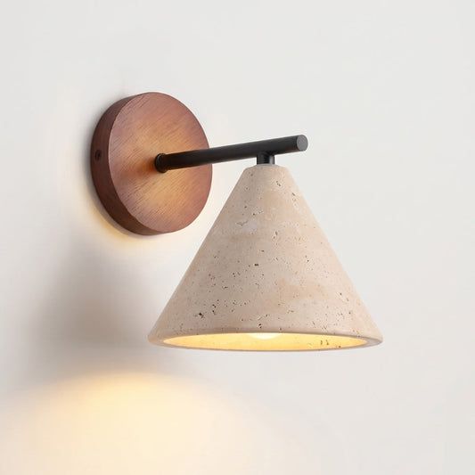 Wall-mounted light fixture with wooden base and concrete cone shade on a white wall.