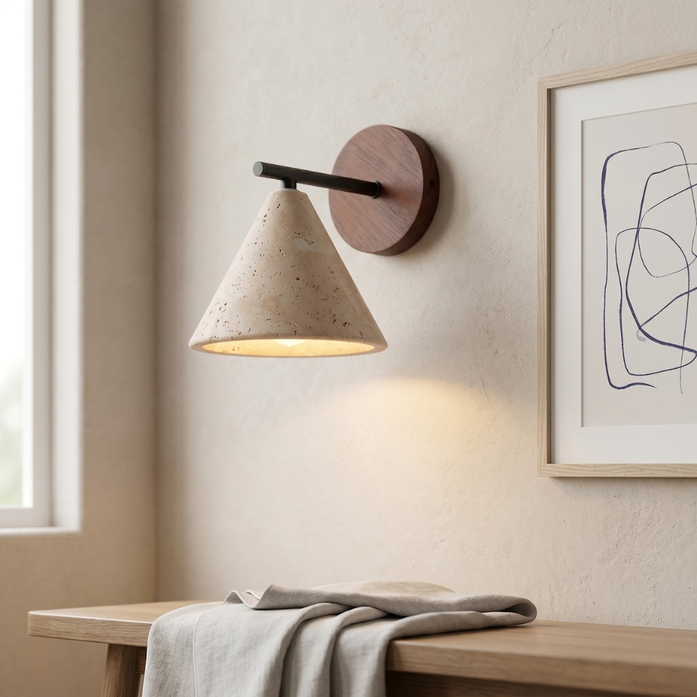 Modern wall lamp with wooden base and concrete shade in a minimalistic room.