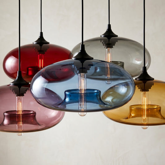 Colorful glass pendant lights hanging against a neutral background