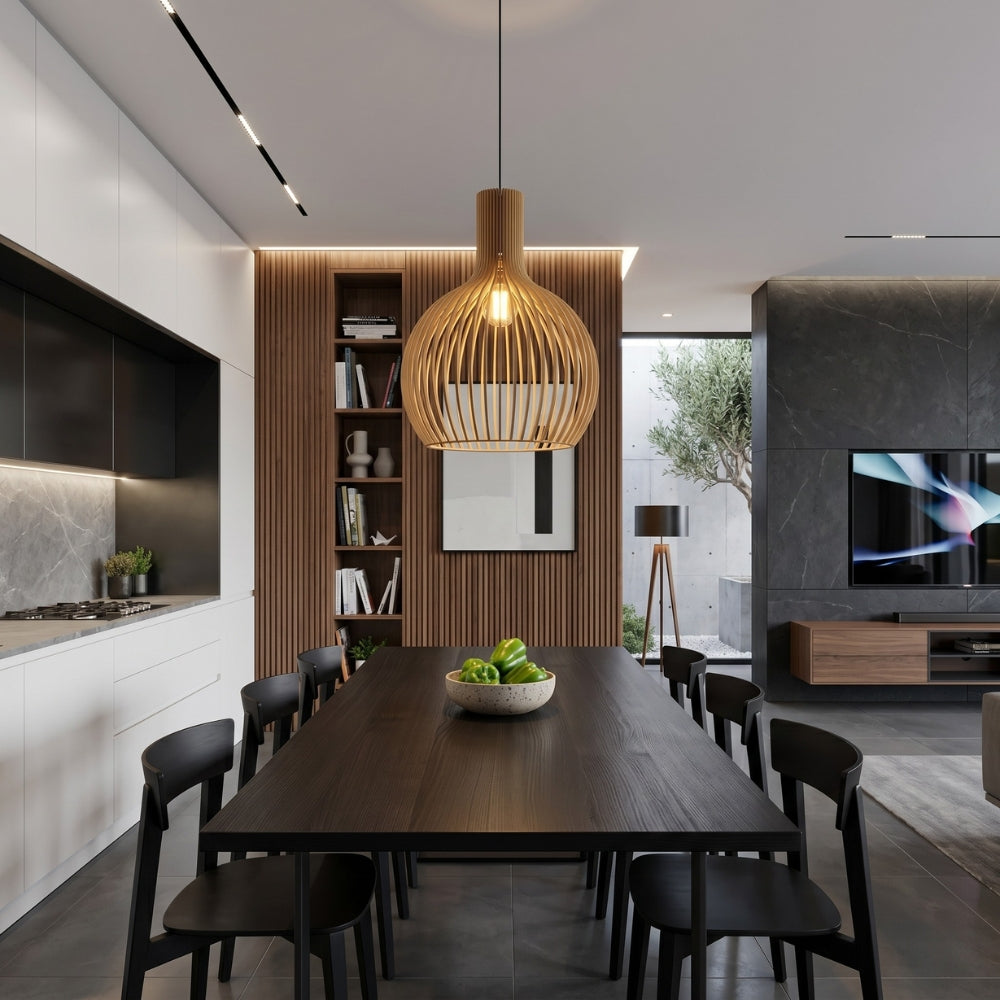 Modern kitchen and dining area with a wooden pendant light, bookshelf, and TV.