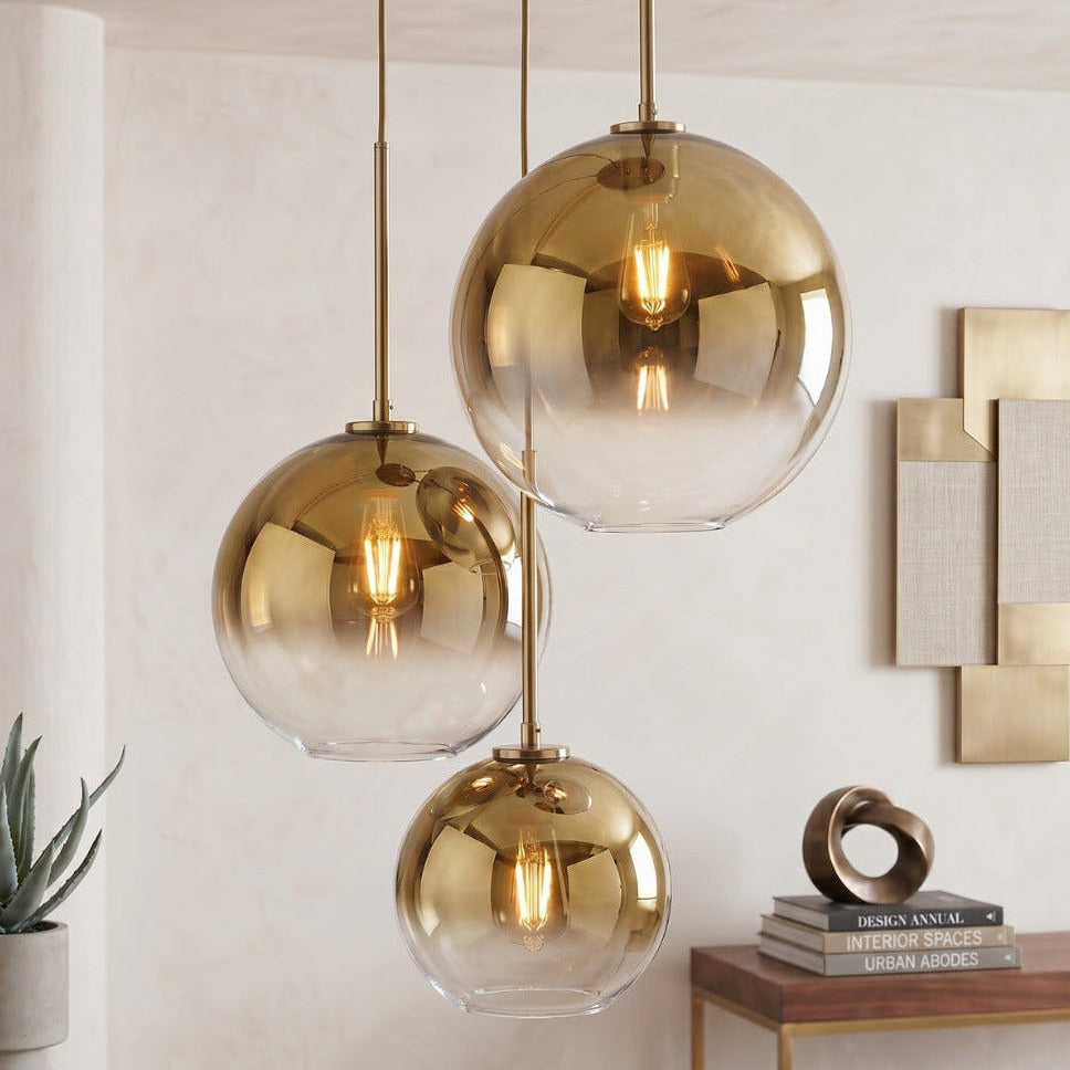 Zaire spherical glass gold pendant lights by Hadley Decor