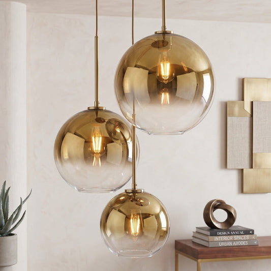 Zaire spherical glass gold pendant lights by Hadley Decor