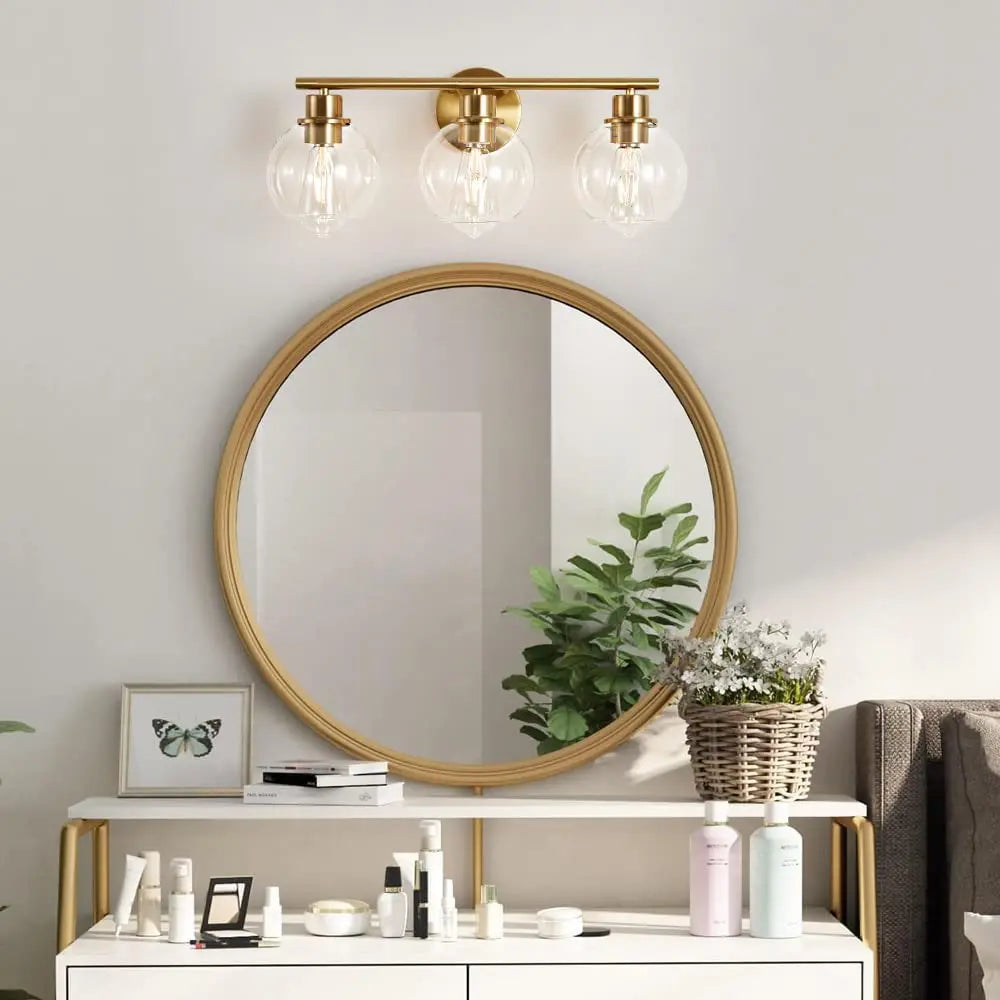 Gold wall light with three bulbs