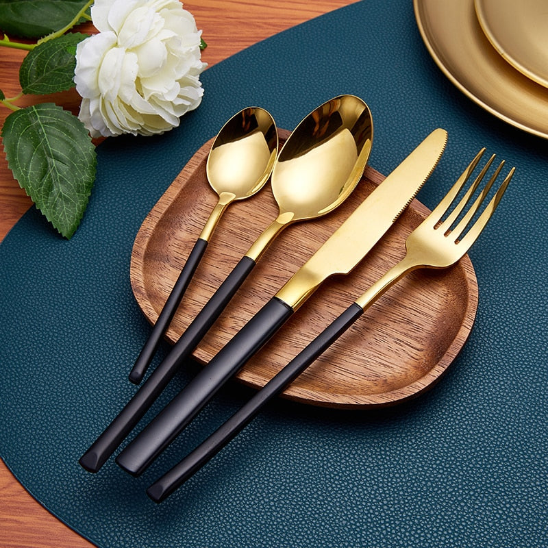 gold and black handle modern flatware set
