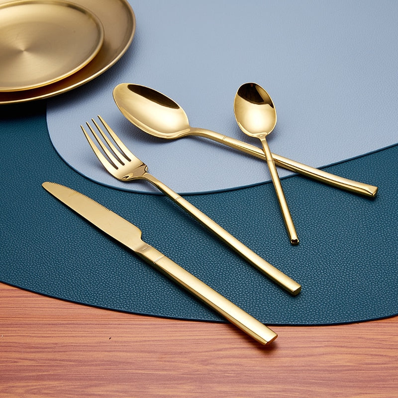 polished gold spoon, fork, and knife set