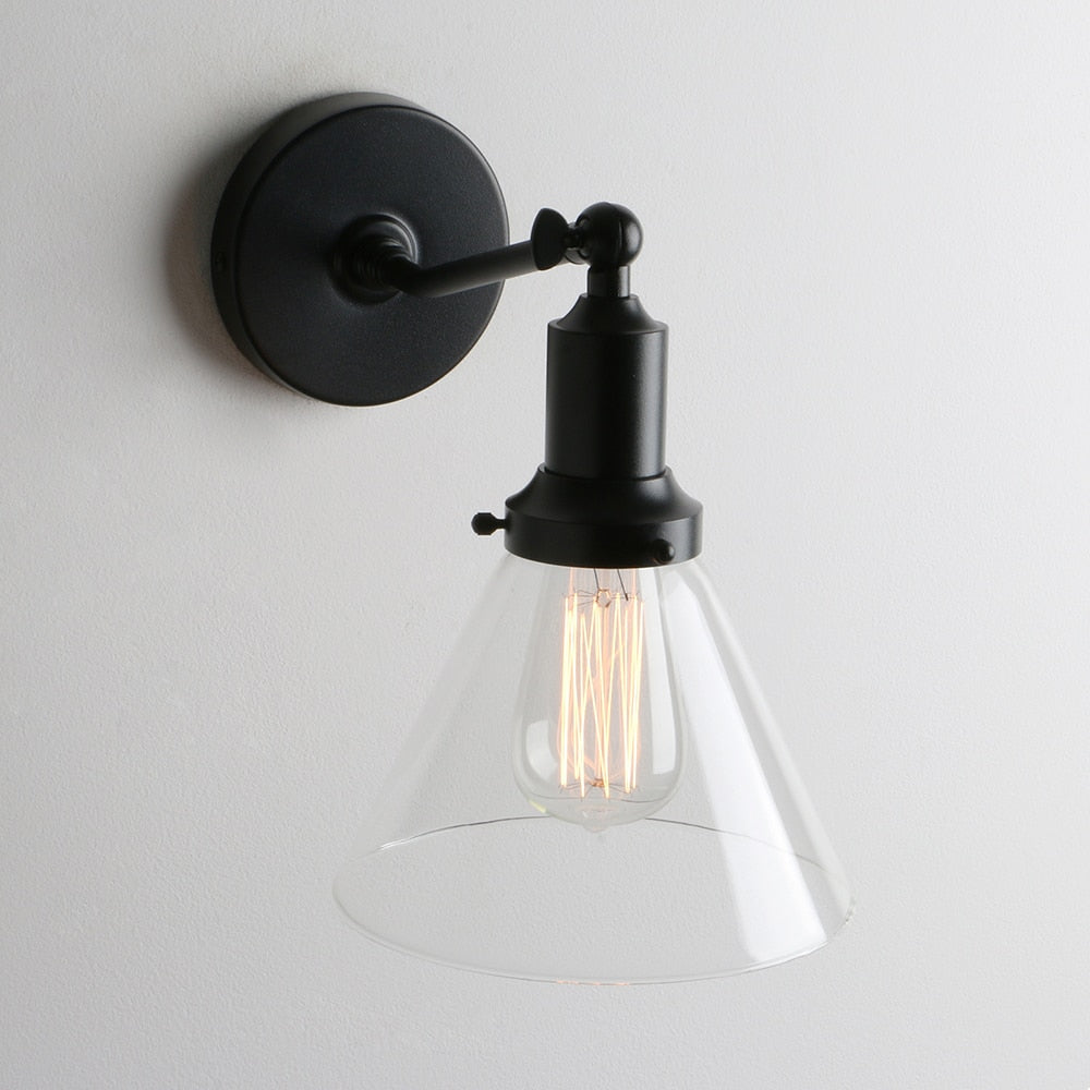 black modern wall sconce with glass shade