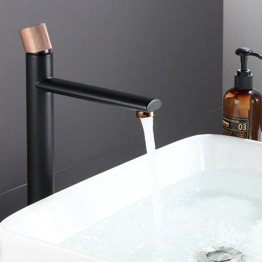 Modern rose gold accented bathroom faucet