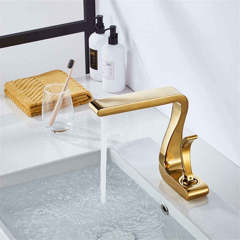 modern bathroom faucet in polished gold