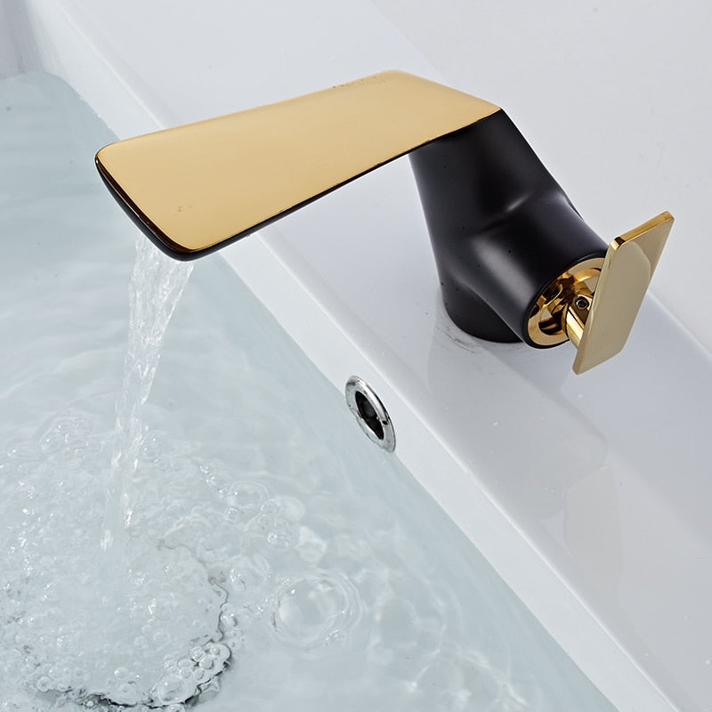 Black and gold bathroom faucet